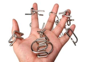 5954 *IQ Metal Puzzle* (8x10.5 cm.) 9 Diferentes. - Imagen 2