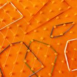 9581 *Geoplano Plástico 2 Caras* (16x16 cm.) 100 Postes.